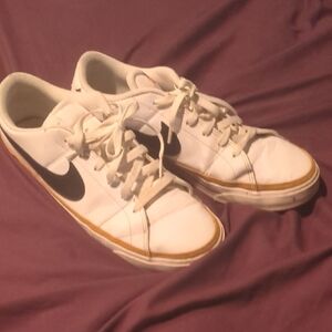Nike White Low-Top Sneakers with Black Swoosh and Gum Trim